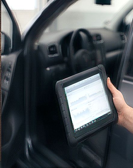 Diagnostic tablet connected at the driver's door